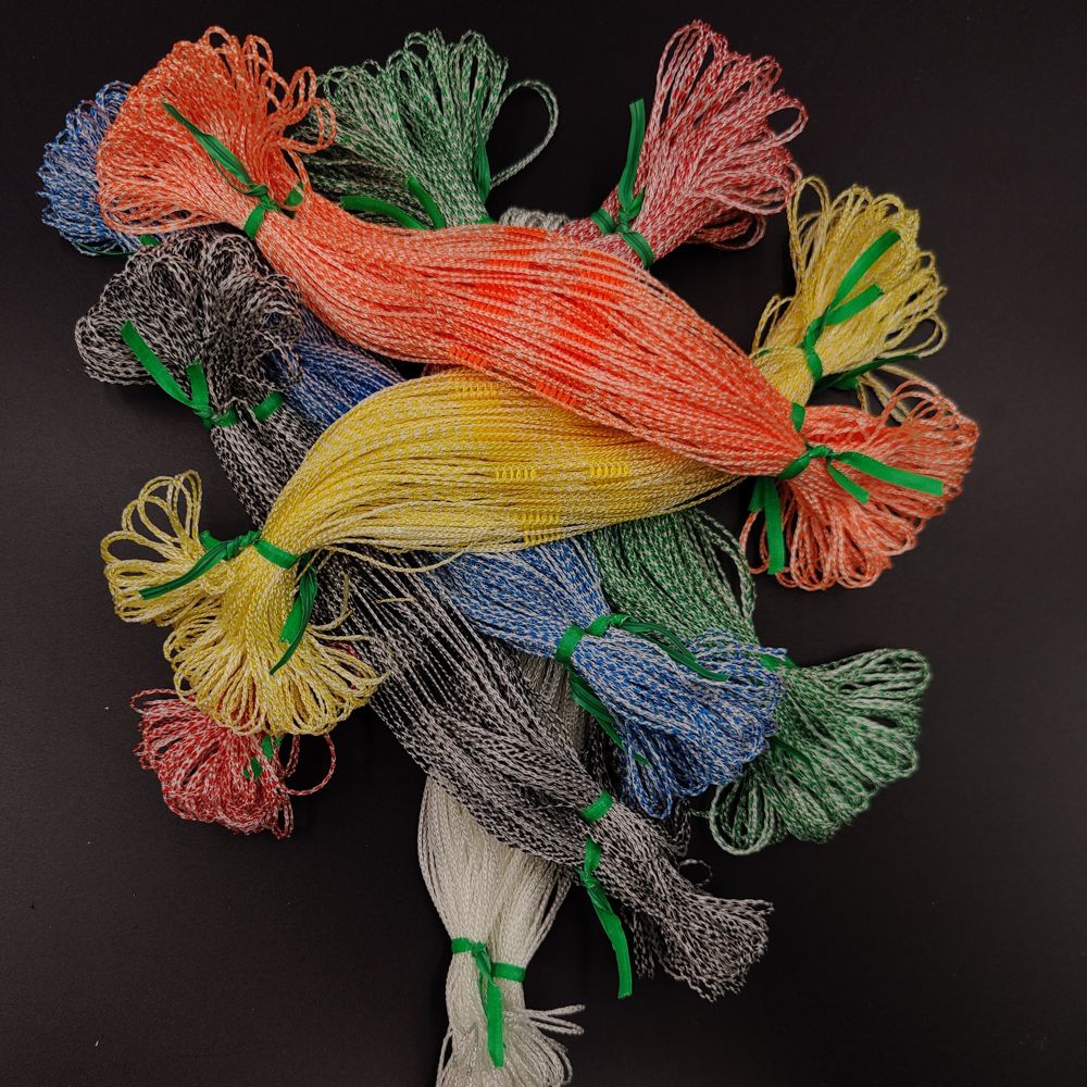 Bundle of white Texsolv heddles